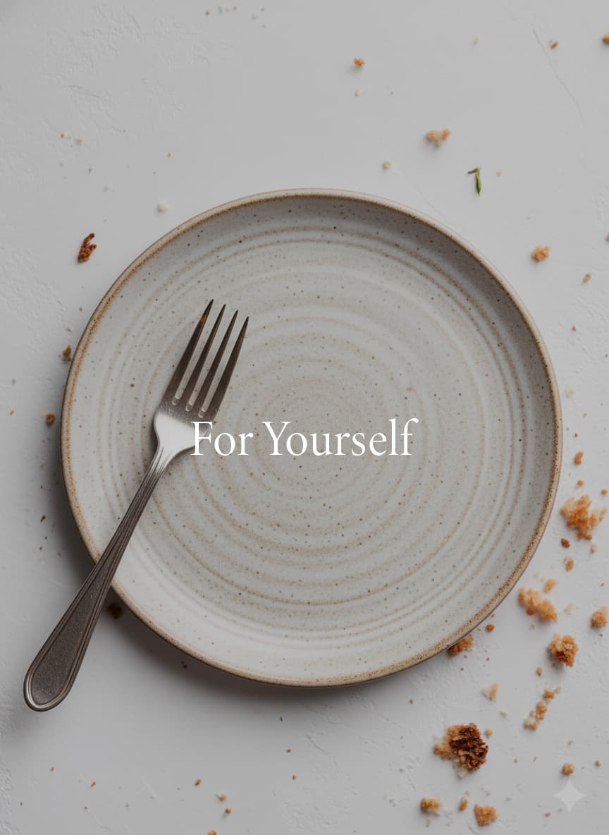 Single fork on ceramic plate representing individual cookbook creation