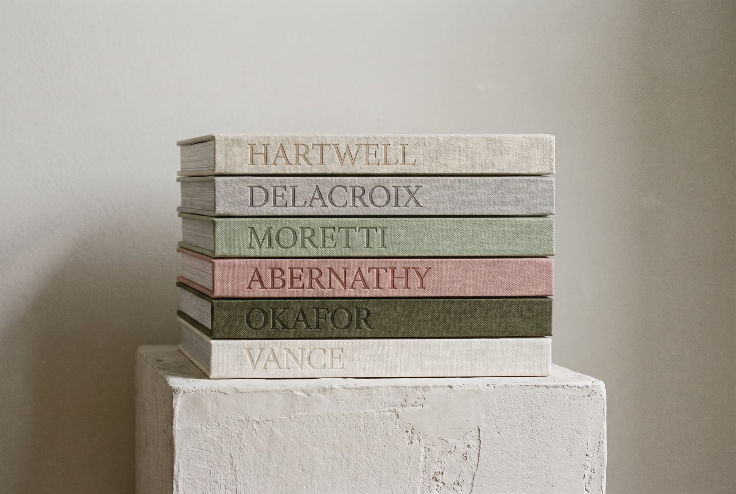 The spines of the collection, stacked: Hartwell, Delacroix, Moretti