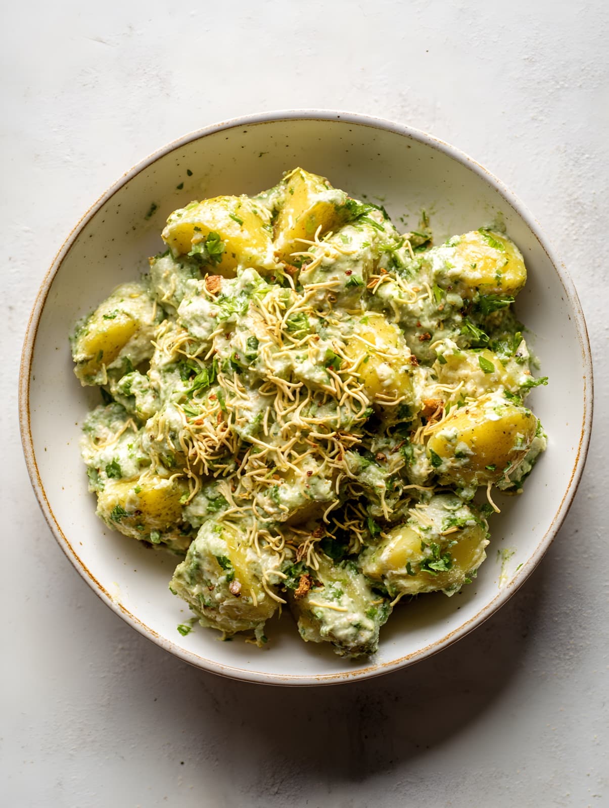 Potatoes in green chutney with sev