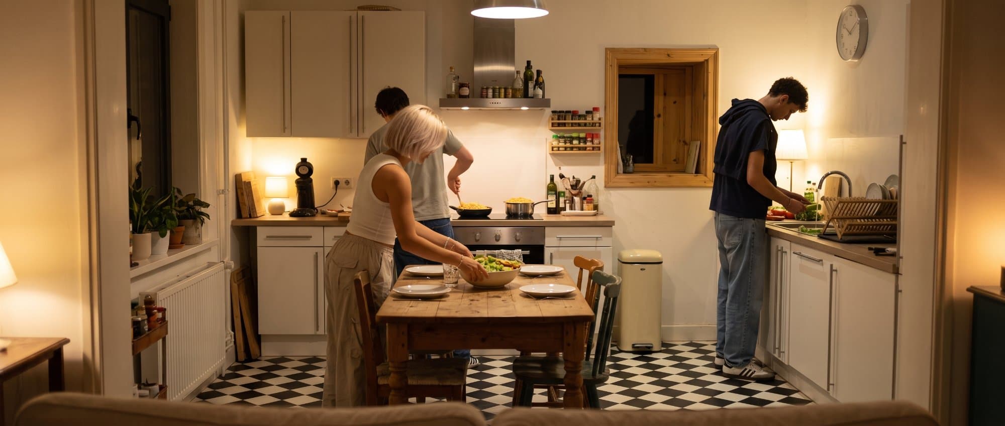 Friend cooking together in cozy apartment